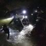 Thai rescue workers inside the cave complex where 12 boys and their soccer coach went missing. 