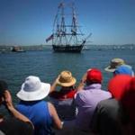 A crowd gathered Wednesday on a pier to photograph the USS Constitution as it came into view. The ship headed to Castle Island in South Boston for a turnaround.