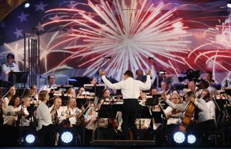 BOSTON, MA - 07/04/2018 Conductor Keith Lockhart conducts the Boston Pops Fireworks Spectacular. Despite the heat; 