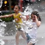 Children played in the fountain on the Rose Fitzgerald Kennedy Greenway in Boston on Tuesday, the day it hit 98. 