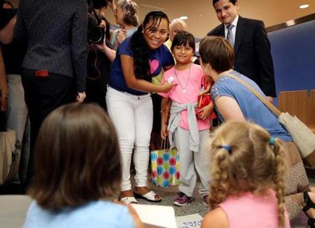 Boston, MA - July 05, 2018: Angelica Rebeca Gonzalez-Garcia and her 8-year-old daughter, Sandy, arrive for a press conference after being reunited at Logan International Airport in Boston, MA on July 05, 2018. The little girl was taken from her at the US-Mexican border after she and her mother fled Guatemala fearing for their lives and seeking asylum in the US. It has been nearly two months since Gonzalez-Garcia has seen her child. She sued the federal government last week demanding the immediate release of the little girl. (Four nearly identical federal lawsuits, all demanding the immediate release of their children who were forcibly taken from them at the US-Mexican border as a result of the Trump administration?s zero-tolerance policy for people who enter the country illegally. All four mothers were told the same thing: A recent rule change by the federal government now requires everyone in the house where they will reside be fingerprinted for criminal and immigration background checks, a process that could take weeks. The children have been placed in a system designed for those who actually enter the country without parents and are captive to bureaucratic malaise -- or cruelty depending on who's asked.) (Craig F. Walker/Globe Staff) section: metro reporter:
