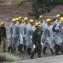 Rescuers walk toward the entrance to a cave complex where five were still trapped, in Mae Sai, Chiang Rai province, northern Thailand on Tuesday.