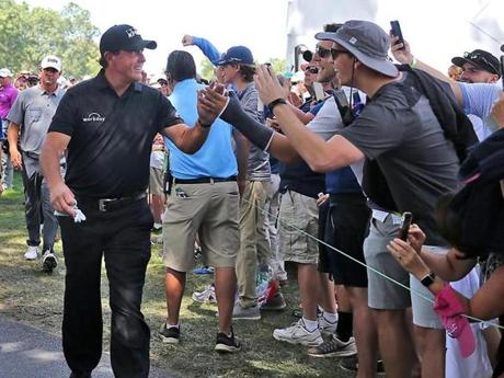 Phil Mickelson high fived fans as he walked off the 16th green during the second round of the Dell Technologies Championship at the TPC Boston in 2017.
