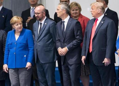 President Trump joined other leaders for a ?family photo? as the NATO summit meeting began in Brussels on Wednesday.
