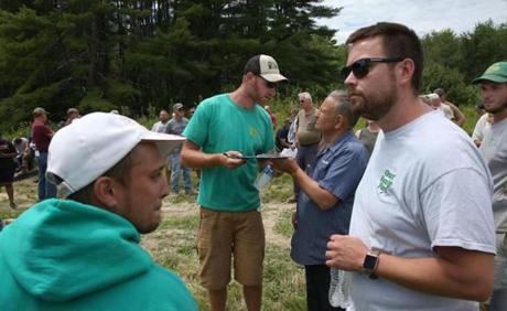 Ben Grant (center) during the auction of his family's farm in Saco, Maine.
