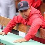 Boston MA 4/29/18 Boston Red Sox manager Alex Cora checking the dampness of the bench before they play the Tampa Bay Rays at Fenway Park. (photo by Matthew J. Lee/Globe staff) topic: reporter: 