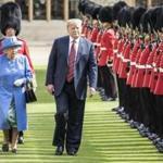 WINDSOR, ENGLAND - JULY 13: U.S. President Donald Trump and Britain's Queen Elizabeth II inspect a Guard of Honour, formed of the Coldstream Guards at Windsor Castle on July 13, 2018 in Windsor, England. Her Majesty welcomed the President and Mrs Trump at the dais in the Quadrangle of the Castle. A Guard of Honour, formed of the Coldstream Guards, gave a Royal Salute and the US National Anthem was played. The Queen and the President inspected the Guard of Honour before watching the military march past. The President and First Lady then joined Her Majesty for tea at the Castle. (Photo by Richard Pohle - WPA Pool/Getty Images)