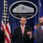 Deputy Attorney General Rod Rosenstein (center), Acting Principal Associate Deputy Attorney General Edward O'Callaghan (right) and Assistant Attorney General John Demers held a news conference at the Department of Justice on Friday.
