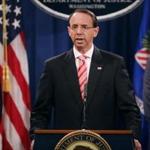WASHINGTON, DC - JULY 13: U.S. Deputy Attorney General Rod Rosenstein (C) holds a news conference at the Department of Justice July 13, 2018 in Washington, DC. Rosenstein announced indictments against 12 Russian intelligence agents for hacking computers used by the Democratic National Committee, the Hillary Clinton campaign, the Democratic Congressional Campaign Committee and other organizations. (Photo by Chip Somodevilla/Getty Images)