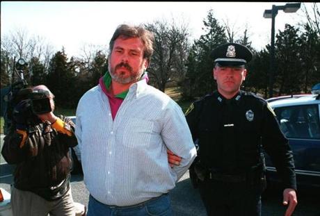 Emory G. Snell Jr. as he arrived for his 1995 arraignment at Barnstable District Court. He was convicted later that year of murdering his wife, Elizabeth Lee, in their home in Marstons Mills. 
