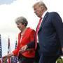 President Donald Trump and British Prime Minister Theresa May hold hands at the conclusion of their joint news conference at Chequers, in Buckinghamshire, England, Friday, July 13, 2018. (AP Photo/Pablo Martinez Monsivais)