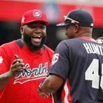 WASHINGTON, DC - JULY 15: Manager David Ortiz of the World Team (L) and Manager Torii Hunter of the U.S. Team greet one another before the SiriusXM All-Star Futures Game at Nationals Park on July 15, 2018 in Washington, DC. (Photo by Patrick McDermott/Getty Images)