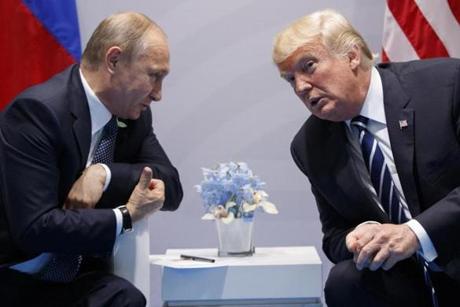 FILE - In this July 7, 2017 file photo U.S. President Donald Trump meets with Russian President Vladimir Putin at the G-20 Summit in Hamburg. Both leader will meet for summit on Monday, July 16, 2018 in Helsinki, Finland. (AP Photo/Evan Vucci, file)

