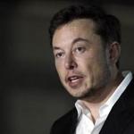FILE - In a Thursday, June 14, 2018 file photo, Tesla CEO and founder of the Boring Company Elon Musk speaks at a news conference, in Chicago. Whether it?s investors betting against his stock, reporters or analysts who ask tough questions or a union trying to organize his workers, Elon Musk has fought back, often around the clock on Twitter. But when Musk called a British diver involved in the Thailand cave rescue a pedophile to 22.3 million Twitter followers on July 15, he may have gone one tweet too far. (AP Photo/Kiichiro Sato, File)
