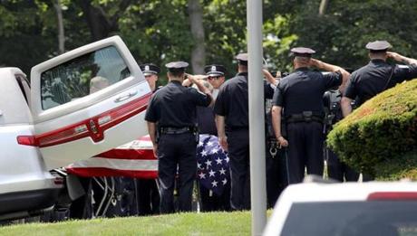Weymouth, MA - 7/16/18 - The casket of slain Weymouth Police Officer Michael Chesna (cq), 42, is unloaded at the McDonald Keohane Funeral Home (cq), in Weymouth. Chesna was fatally shot early Sunday morning, as was a woman in a home. Photo by Pat Greenhouse/Globe Staff Topic: 17weymouth Reporter: Emily Sweeney
