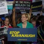 WASHINGTON, DC - JULY 09: Senator Elizabeth Warren (D-MA) speaks to protesters in front of the U.S. Supreme Court on July 9, 2018 in Washington, DC. President Donald Trump is set to announce his Supreme Court pick Monday night. (Photo by Tasos Katopodis/Getty Images)