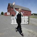 Sen. Elizabeth Warren waved as she arrived at Belkin Family Lookout Farm in Natick before a town hall event on July 8.