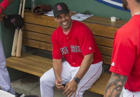 Fort Myers, FL- 2/23/2018 - Red Sox Spring Training- Credit Stan Grossfeld/Boston Globe--- Red Sox manager Alex Cora enjoys a laugh prior to managing his first big league exhibition game.
