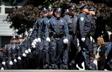 Boston, MA - July 11, 2018: Members of the Weymouth Police Department march into St. Mary of the Sacred Heart Church for the wake of Sergeant Michael C. Chesna in Hanover, MA on July 19, 2018. (Relatives and friends are invited to attend visiting hours on Thursday from 4 p.m. to 8 p.m. at St. Mary of the Sacred Heart Church in Hanover, and a funeral Mass will be held the following day at 11 a.m. in the church. Chesna, a 42-year-old, six-year veteran of the Weymouth Police Department, will be buried in Braintree?s Blue Hill Cemetery. Chesna was shot with his own gun Sunday morning, according to authorities. Emanuel A. Lopes, the 20-year-old man charged with Chesna?s murder and the slaying of Vera Adams, 77, was ordered held without bail Tuesday.)) (Craig F. Walker/Globe Staff) section: metro reporter: Kowalczyk St. 
