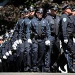 Boston, MA - July 11, 2018: Members of the Weymouth Police Department march into St. Mary of the Sacred Heart Church for the wake of Sergeant Michael C. Chesna in Hanover, MA on July 19, 2018. (Relatives and friends are invited to attend visiting hours on Thursday from 4 p.m. to 8 p.m. at St. Mary of the Sacred Heart Church in Hanover, and a funeral Mass will be held the following day at 11 a.m. in the church. Chesna, a 42-year-old, six-year veteran of the Weymouth Police Department, will be buried in Braintree?s Blue Hill Cemetery. Chesna was shot with his own gun Sunday morning, according to authorities. Emanuel A. Lopes, the 20-year-old man charged with Chesna?s murder and the slaying of Vera Adams, 77, was ordered held without bail Tuesday.)) (Craig F. Walker/Globe Staff) section: metro reporter: Kowalczyk St. 