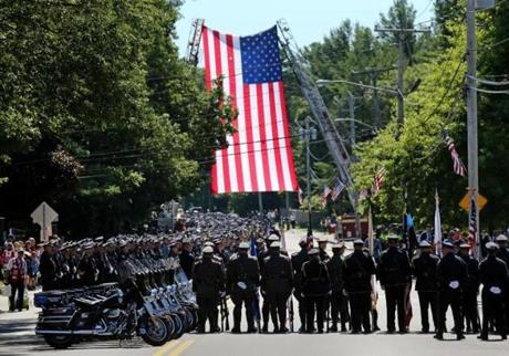 Police stood in formation during the funeral for Weymouth Police Sergeant Michael C. Chesna at St. Mary of the Sacret Heart Church in Hanover Friday.  
