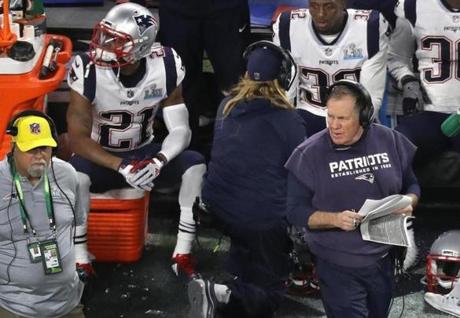 Malcolm Butler on the bench during Super Bowl LII while Bill Belichick patrols the sideline. 
