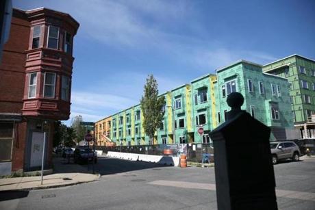 07/21/2018 East Boston Ma -East Boston is seeing growth in housing and other developments. New construction on Decatur Street and Liverpool Street in the shadow of older housing. Reporter:Topic
