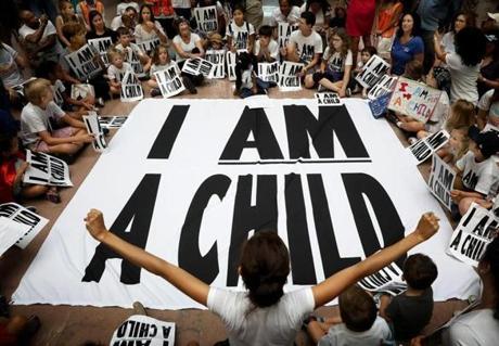 WASHINGTON, DC - JULY 26: Protesters and their children participate in a sit-in in the Hart Senate Office Building to mark the court-ordered deadline for the Trump Administration to reunify thousands of families separated at the border July 26, 2018 in Washington, DC. Members of the The groups protesting, the Families Belong Together Coalition and the National Domestic Workers Alliance and children and families, protested 