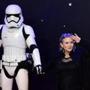 (FILES) In this file photo taken on December 16, 2015 US actress Carrie Fisher (R) poses with a storm trooper as she attends the opening of the European Premiere of 
