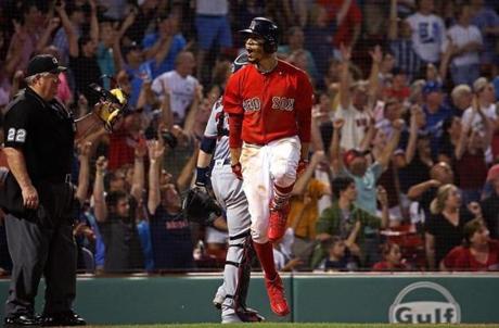 Boston, MA - 7/27/2018 - (10th inning) Boston Red Sox right fielder Mookie Betts (50) dances as he watches his game winning home run in the tenth inning leave the park. The Boston Red Sox host the Minnesota Twins in the second of a four game series at Fenway Park. - (Barry Chin/Globe Staff), Section: Sports, Reporter: Peter Abraham, Topic: 28Red Sox-Twins, LOID: 8.4.2664046326.
