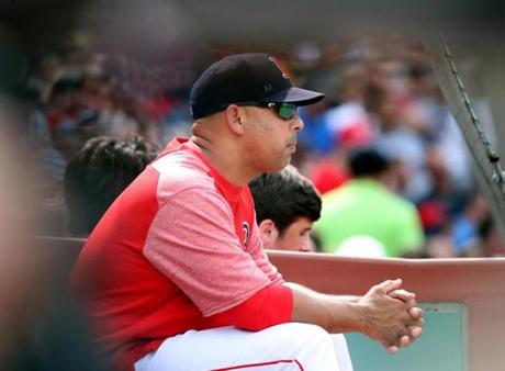Boston MA 7/29/18 Boston Red Sox manager Alex Cora on the bench against the Minnesota Twins during seventh inning MLB action at Fenway Park. (photo by Matthew J. Lee/Globe staff) topic: reporter: 
