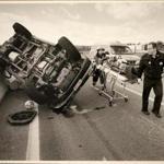 A photo in Rick Stack's collection shows him (right) at the scene of a car crash. Captain Rick Stack, a long-time North Attleboro firefighter, has been diagnosed with PTSD.