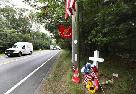 Cotuit, MA - 7/30/18 - A memorial has been erected near the scene of a fatal head-on crash, on Saturday in Cotuit. New father Kevin Quinn (cq), of Mashpee, was killed when a driver being pursued by police crashed into him. That driver also died at the scene. Photo by Pat Greenhouse/Globe Staff Topic 31pursuit Reporter: J.D. Capelouto
