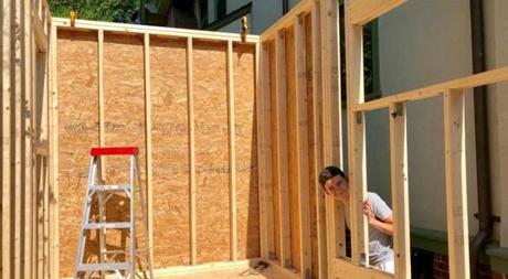 Duncan Jurayj, 16, is building a tiny house on top of a trailer in his Brookline driveway after receiving a $5,000 grant from his high school, Beaver Country Day School in Chestnut Hill. 
