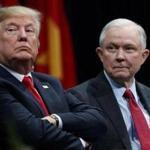 FILE - In this Dec. 15, 2017, file photo, President Donald Trump sits with Attorney General Jeff Sessions during the FBI National Academy graduation ceremony in Quantico, Va. Trump?s White House counsel personally lobbied Attorney General Jeff Sessions to not recuse himself from the Justice Department?s investigation into potential ties between Russia and the Trump campaign. (AP Photo/Evan Vucci, File)