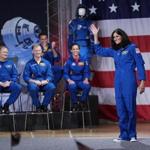 Astronaut Sunita Williams waved after being introduced during a NASA event to announce the astronauts assigned to crew the first flight tests and missions of the Boeing CST-100 Starliner and SpaceX Crew Dragon. 