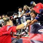Foxborough MA 7/30/18 New England Patriots Tom Brady autographs New England Patriots fan Megan Uhrynowski, 19, of Stratford, Conn. arm during a special night practice for season ticket holders and VIP's at Gillette Stadium. (photo by Matthew J. Lee/Globe staff) topic: reporter: 