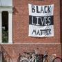 A ?Black Lives Matter? banner hung on a building of Smith College on Friday.