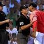 Boston, MA - 8/03/2018 - (1st inning) Boston Red Sox manager Alex Cora (20) is restrained by umpire Phil Cuzzi (10) as he argues with home plate umpire Adam Hamari (78) during the first inning. Cora was ejected from the game. The Boston Red Sox host the New York Yankees in Game 2 of a four game series at Fenway Park. - (Barry Chin/Globe Staff), Section: Sports, Reporter: Peter Abraham, Topic: 04Red Sox-Yankees, LOID: 8.4.2729609219.