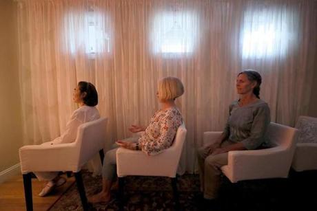 From left, Suriphan Ratanamatmongkol, Kate MacDonald, and Diane Medeiros meditated at the Inner Space Meditation Center. 
