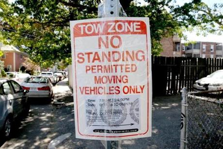 A moving truck sign on Highgate Street in Allston reserved a parking space on Sept. 1, 2016. 
