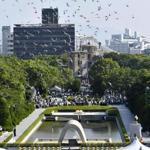Doves flew over the memorial cenotaph in Hiroshima on Monday.