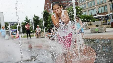 Lily Ward, 7, played in Rings Fountain on the Rose Kennedy Greenway earlier this summer. The fountain is just one place to beat the sweltering temps this week.

