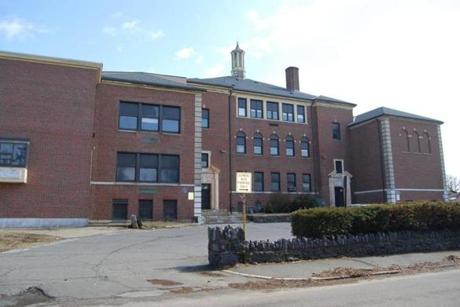The school on Greenwood Avenue in Swampscott had functioned as both a middle school and high school over the years. The time capsule was found buried under the stairs. 
