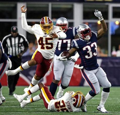 Boston, MA - 8/09/2018 - (2nd quarter) New England Patriots running back Jeremy Hill (33) runs for a first down during the first quarter. The New England Patriots host the Washington Redskins in a pre-season exhibition game at Gillette Stadium. - (Barry Chin/Globe Staff), Section: Sports, Reporter: James M. McBride, Topic: 10Patriots-Redskins, LOID: 8.4.2791165379.
