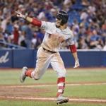 TORONTO, ON - AUGUST 9: Mookie Betts #50 of the Boston Red Sox celebrates as he hits a solo home run to complete the cycle in the ninth inning during MLB game action against the Toronto Blue Jays at Rogers Centre on August 9, 2018 in Toronto, Canada. (Photo by Tom Szczerbowski/Getty Images)