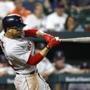 Boston Red Sox's Mookie Betts doubles in the eighth inning of a baseball game against the Baltimore Orioles, Friday, Aug. 10, 2018, in Baltimore. Brock Holt, Steve Pearce and Jackie Bradley Jr. scored on the play. (AP Photo/Patrick Semansky)