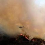 A helicopter dropped water on the so-called Holy Fire on Saturday.