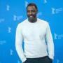 (FILES) In this file photo taken on February 22, 2018 British actor, director and executive producer Idris Elba poses during a photo call for the film 