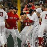 Boston MA 8/5/18 Boston Red Sox Andrew Benintendi is surrounded by his teammates after his game winning walk off hit against the New York Yankees during tenth inning action at Fenway Park. (photo by Matthew J. Lee/Globe staff) topic: reporter: 